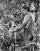 Johnny Weissmuller movie scene photo print featuring a conversation with a kid.