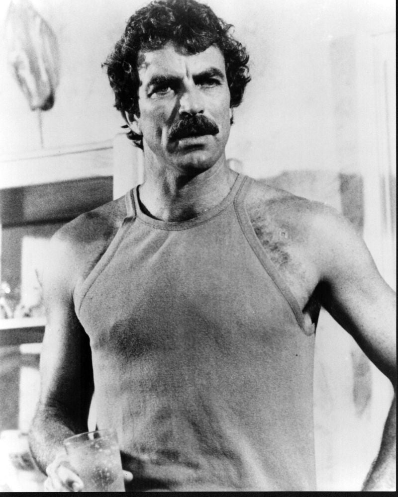 Tom Selleck in tank top on set of Magnum P.I. photo print.