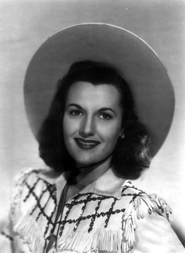 Peggy Stewart as a cowgirl photo print, showcasing classic Western charm.