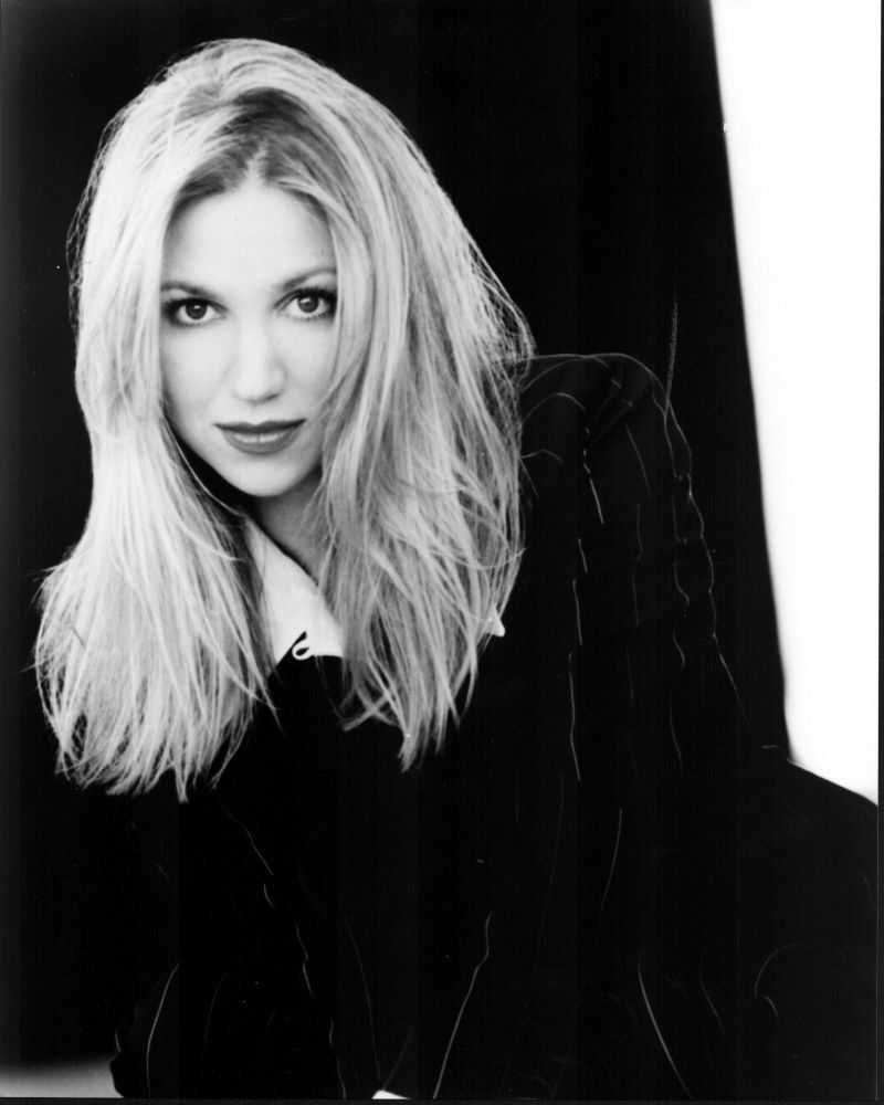 Debbie Gibson black and white photo print in striped jacket.