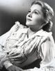 Joan Fontaine looking up in a detailed dress portrait photo print.