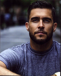Josh Segarra headshot photo print in gray shirt.