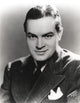 Black and white photo print of Bob Hope smiling in a formal coat.