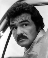 Burt Reynolds film still photo print looking over shoulder.