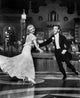 Fred Astaire and Ginger Rogers dancing photo print showcasing their smiles and elegance.