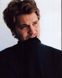 Luke Grimes Biting Sweater Photo Print showcasing charm and style.