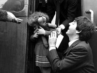 Paul McCartney and a little girl exiting a train photo print