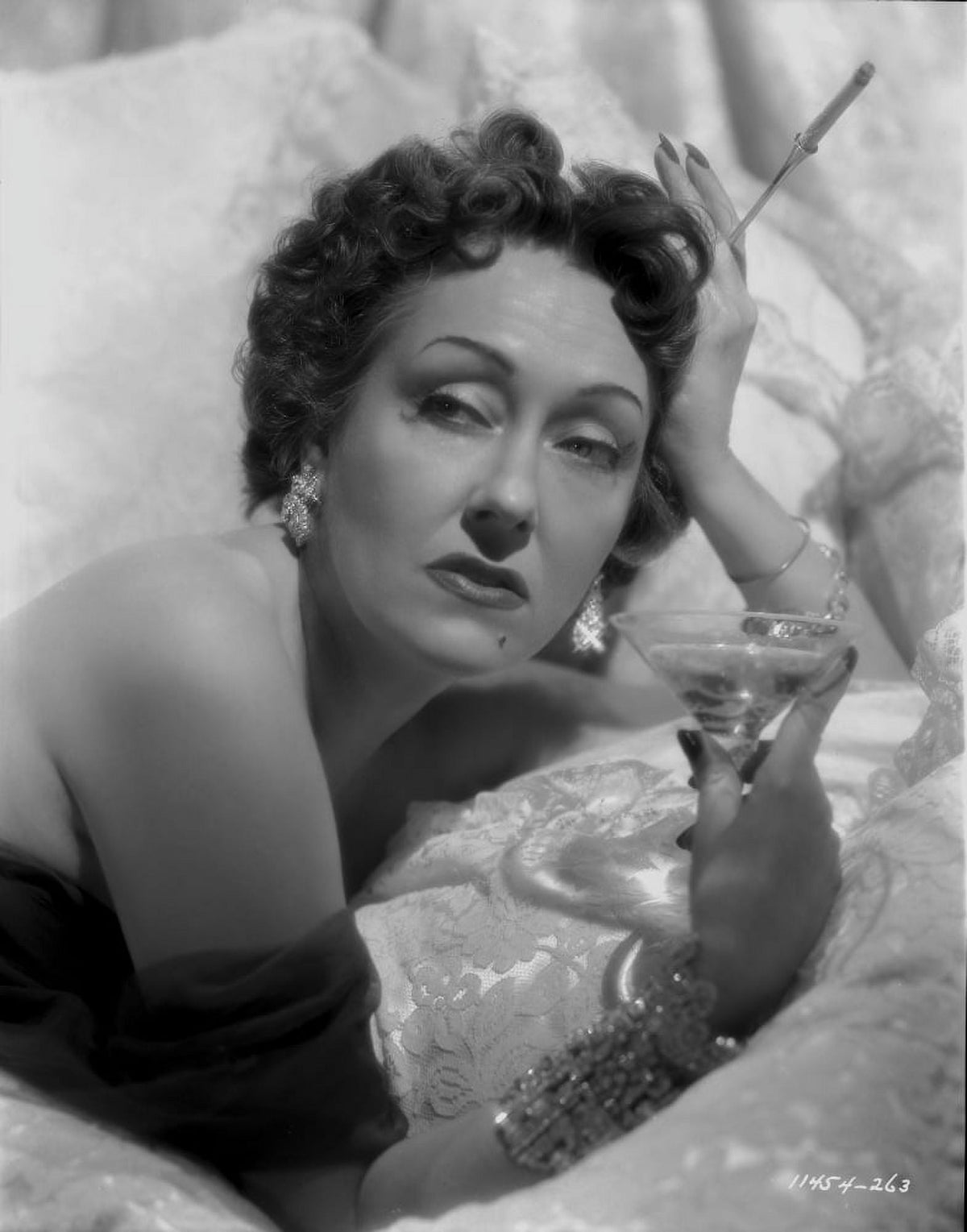 Gloria Swanson posed holding a glass of wine photo print