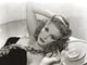 Ann Miller lying down photo print showcasing vintage glamour