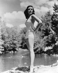 Gene Tierney standing at the edge of a lake photo print.