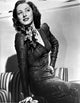 Eleanor Parker Long Sleeve Sitting Photo Print 8x10