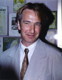 Close-up portrait photo print of Alan Rickman smiling in a grey suit.