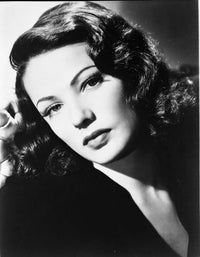 Gene Tierney classic portrait photo print in black dress with serene expression.
