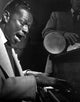 Nat King Cole performing photo print, available in multiple sizes.