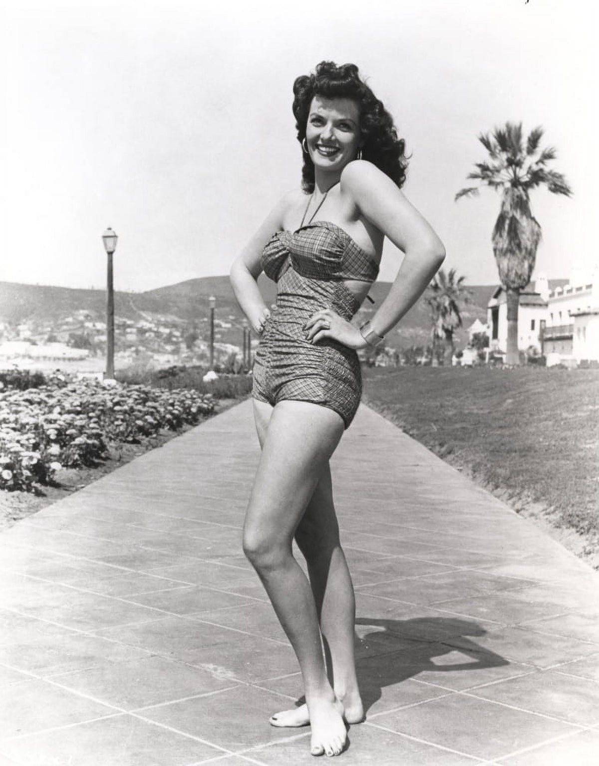 Black and white portrait photo print of Jane Russell in a mini skirt.