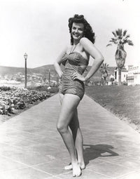 Black and white portrait photo print of Jane Russell in a mini skirt.
