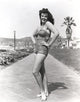 Black and white portrait photo print of Jane Russell in a mini skirt.