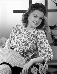 Anne Baxter smiling in a floral dress photo print