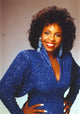 Gladys Knight photo print in sparkling blue dress, showcasing her iconic style.