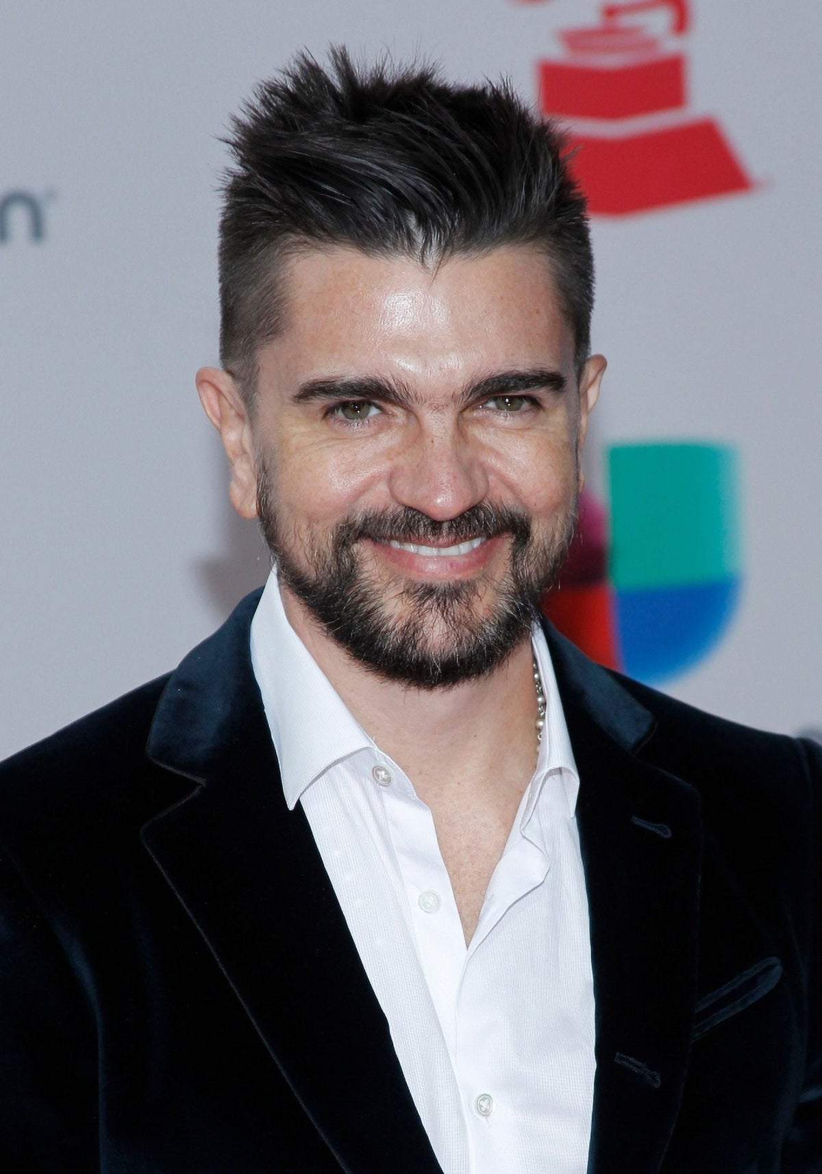 Juanes arriving at the 18th Annual Latin Grammy Awards photo print.