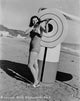 Rita Hayworth photo print in swimwear holding a gun