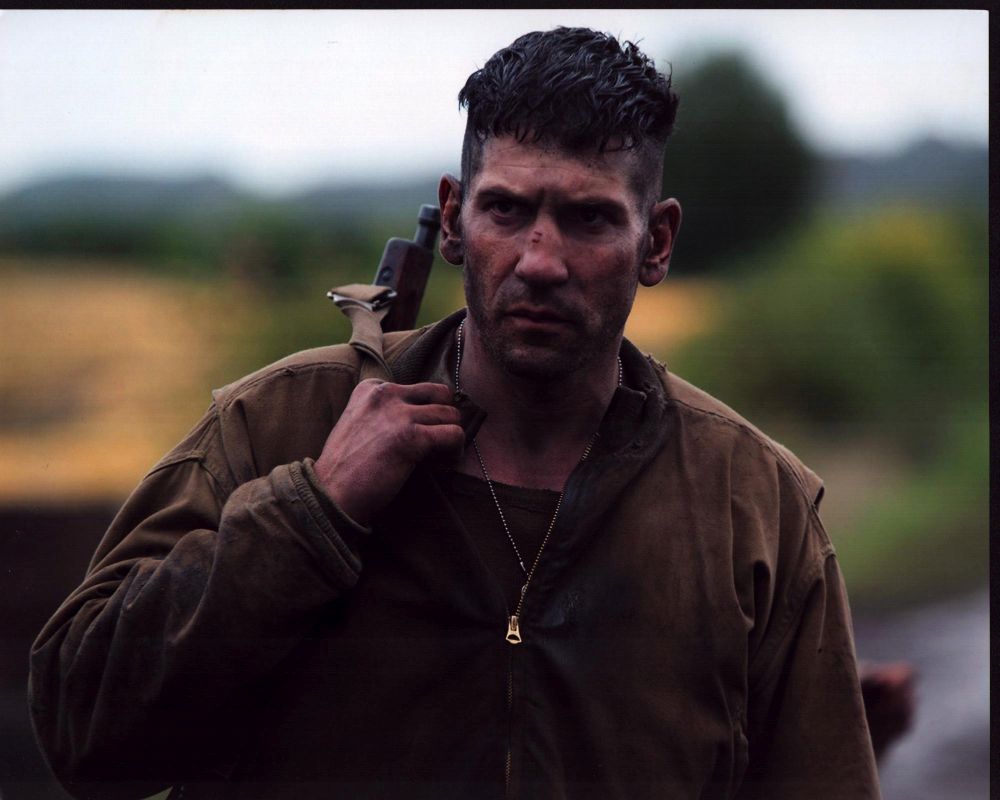 Jon Bernthal Fury photo print with gun slung on shoulder.