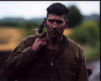 Jon Bernthal Fury photo print with gun slung on shoulder.