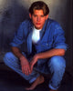Jensen Ackles crouching in denim outfit photo print