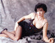 Terri Garber in black spaghetti dress photo print.