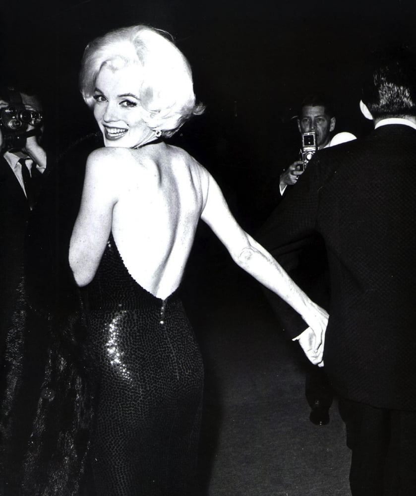 Marilyn Monroe looking over her shoulder in an evening dress photo print.