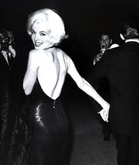 Marilyn Monroe looking over her shoulder in an evening dress photo print.