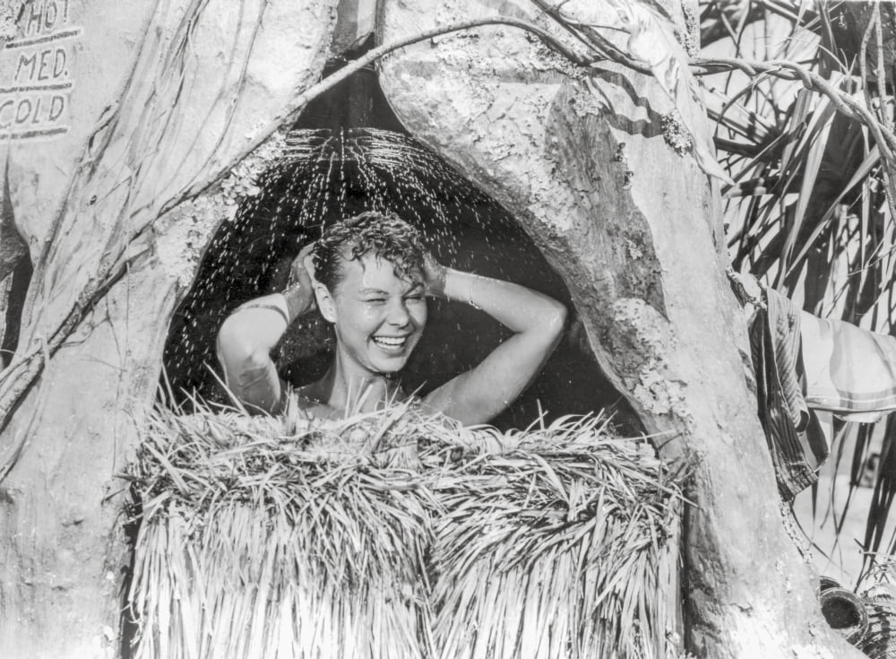 South Pacific women bathing in nipa hut photo print
