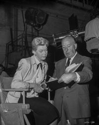 Candid photo print of Alfred Hitchcock on a film set, available in multiple sizes.