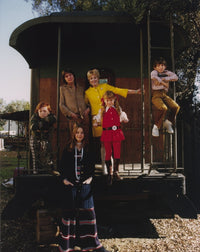The Partridge Family group photo print in formal attire.
