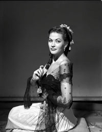 Yvonne De Carlo kneeling pose photo print in black net dress.