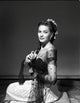 Yvonne De Carlo kneeling pose photo print in black net dress.