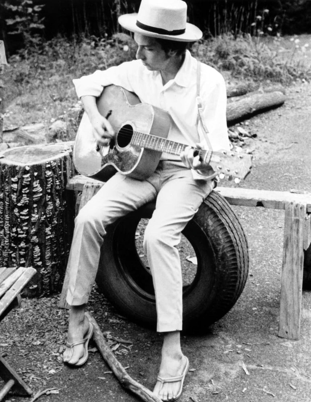 Bob Dylan seated playing guitar photo print.