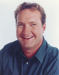 Randy Quaid smiling in a blue polo shirt portrait photo print