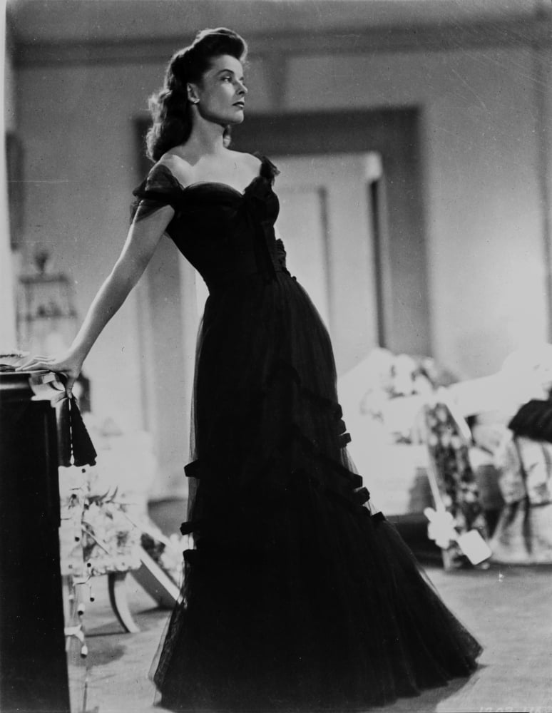 Black and white photo print of Katharine Hepburn in a black dress.