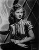 Portrait photo print of Shirley Temple wearing a stripe blouse