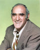 Abe Vigoda in a violet suit photo print, available in multiple sizes.
