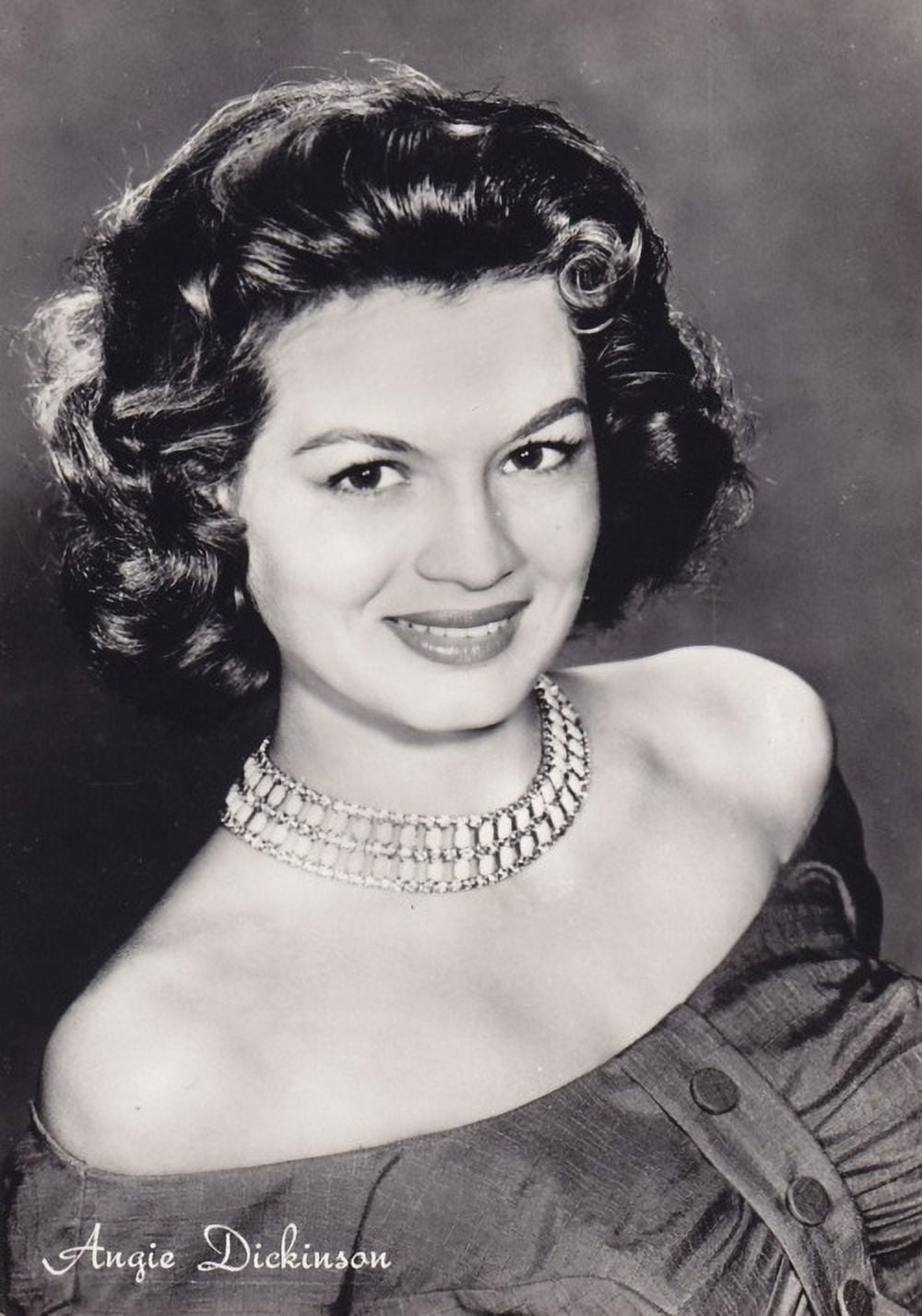 Angie Dickinson headshot photo print featuring a necklace, available in multiple sizes.