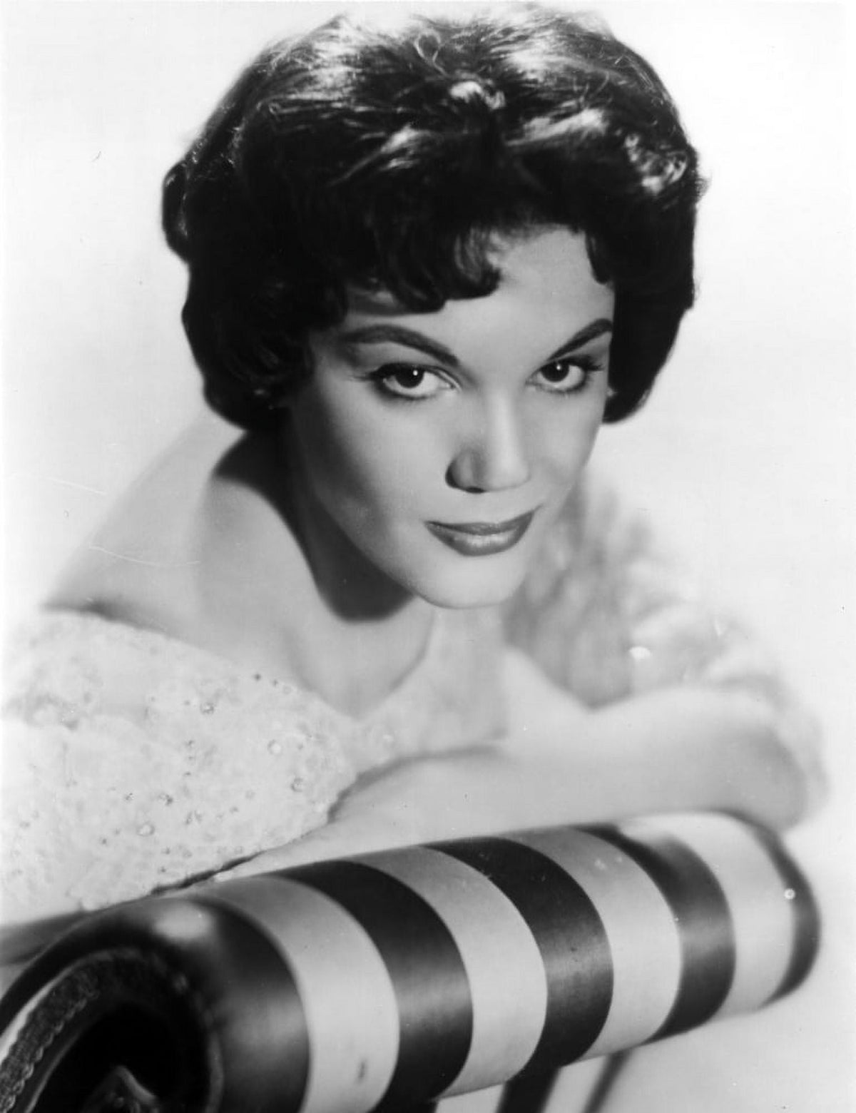 Connie Francis leaning on couch in formal dress photo print