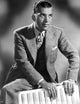 Ed Sullivan seated in formal attire photo print, classic vintage TV portrait.