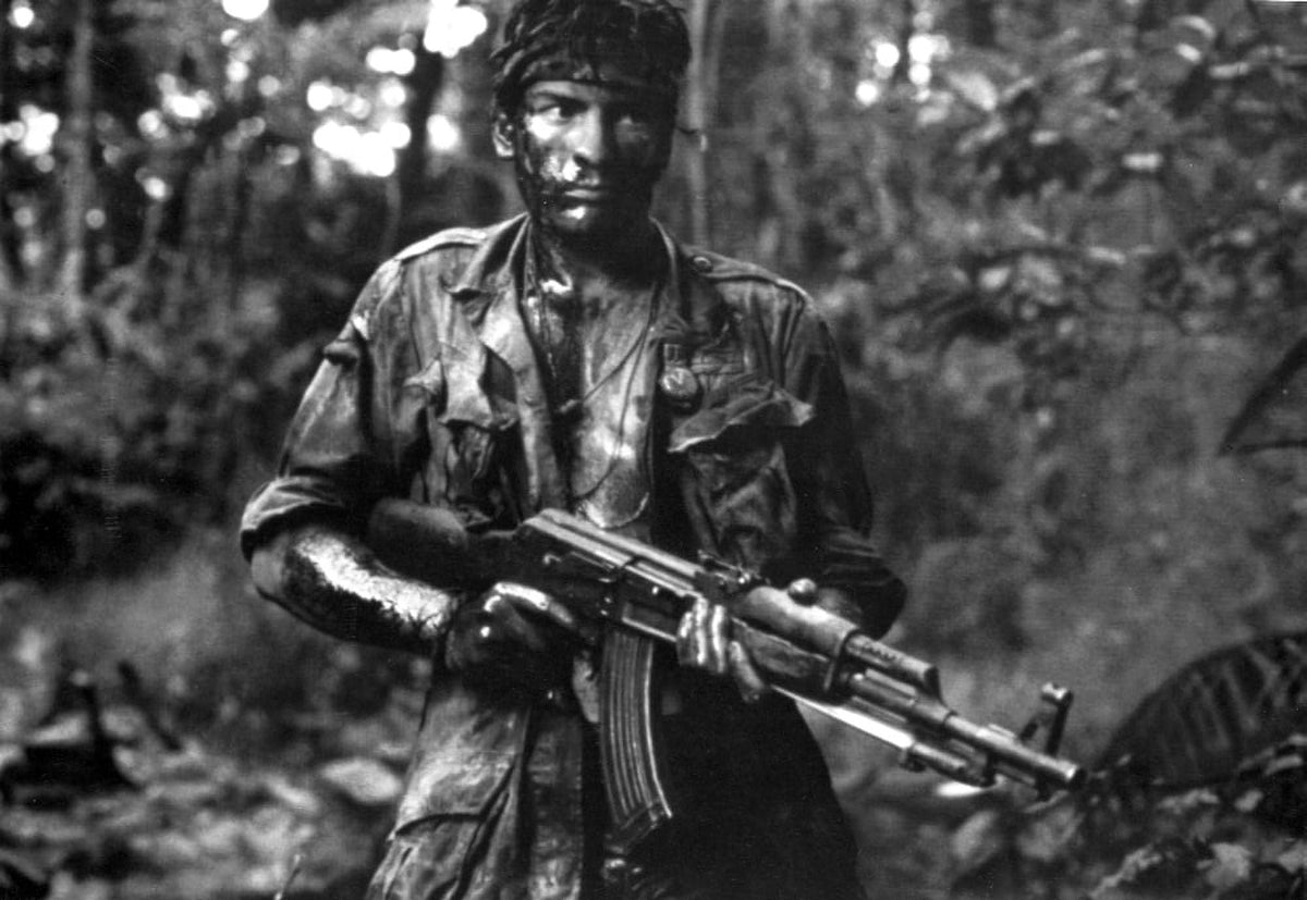 Charlie Sheen film still in military uniform holding a gun photo print