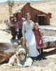 Little House On The Prairie cast group photo print with blue background.