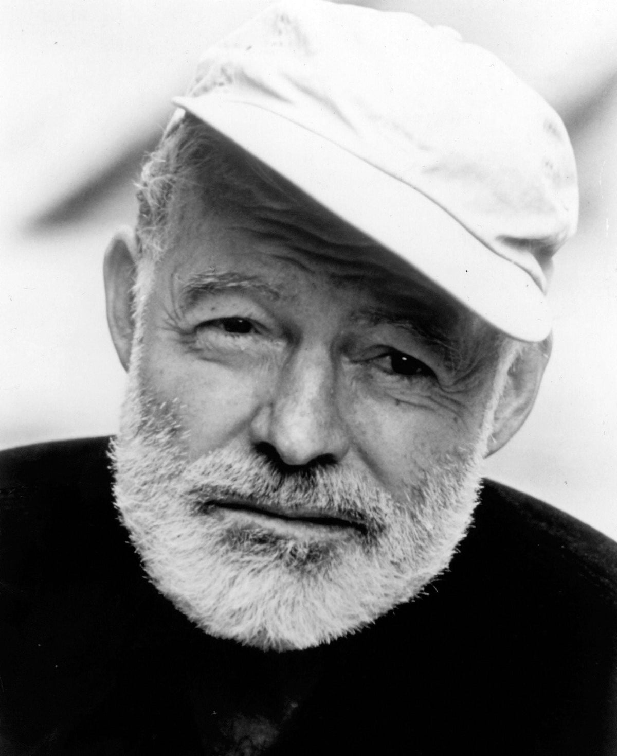 Ernest Hemingway wearing a baseball cap photo print.