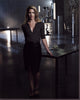 Emily Bett Rickards leaning on a metal table photo print