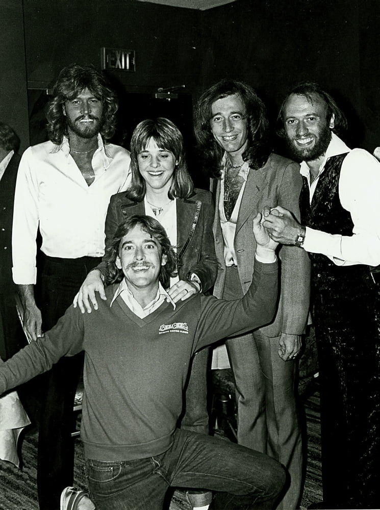 Candid group photo print of The Bee Gees posing together.