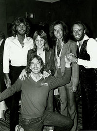 Candid group photo print of The Bee Gees posing together.
